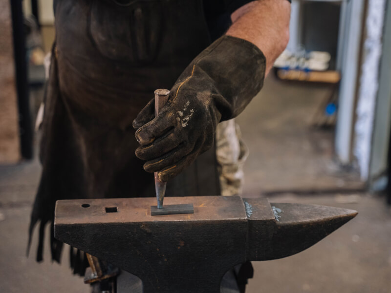 Man in a blacksmithing class